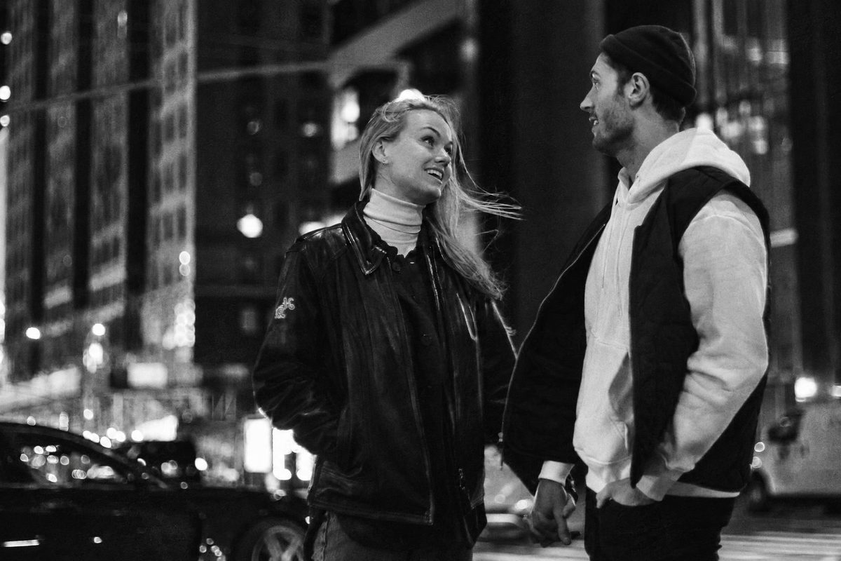 AI-generated: Classic B&W Film AI filter result: couple standing together near a road