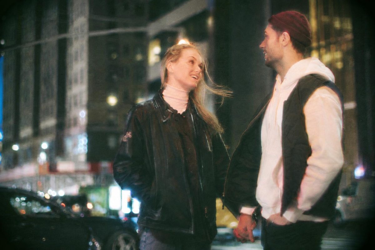 AI-generated: Disposable Camera AI filter result: couple standing together near a road