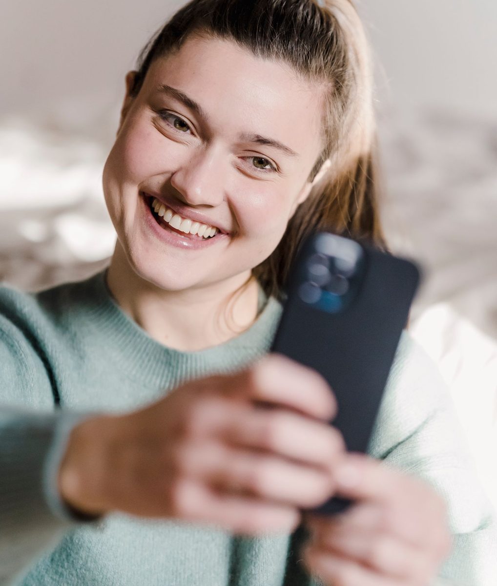 Before: Instant Film Frame AI filter result: young woman taking a selfie