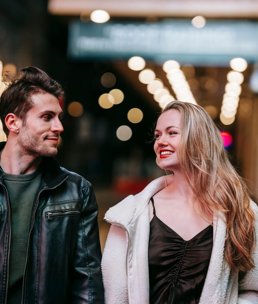 Before: Instant Film Frame AI filter result: smiling couple walking down a street at night