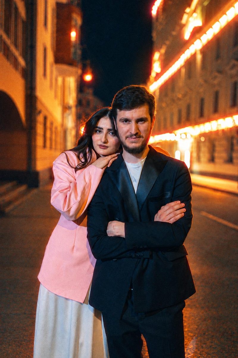 AI-generated: Night Tungsten 800 AI filter result: stylish couple on a city street at night